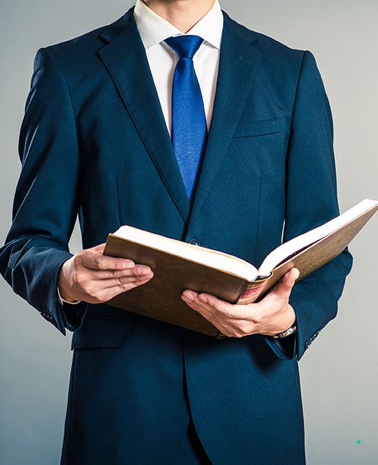 Shoplifting and Criminal Defence Lawyers | Image of a lawyer holding a legal book